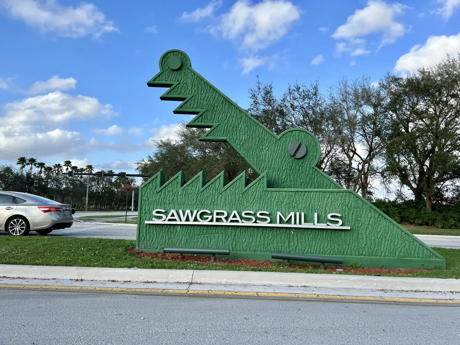 A Sawgrass Mills entrance sign at the Green Toad Road entrance to the outlet mall in Sunrise.