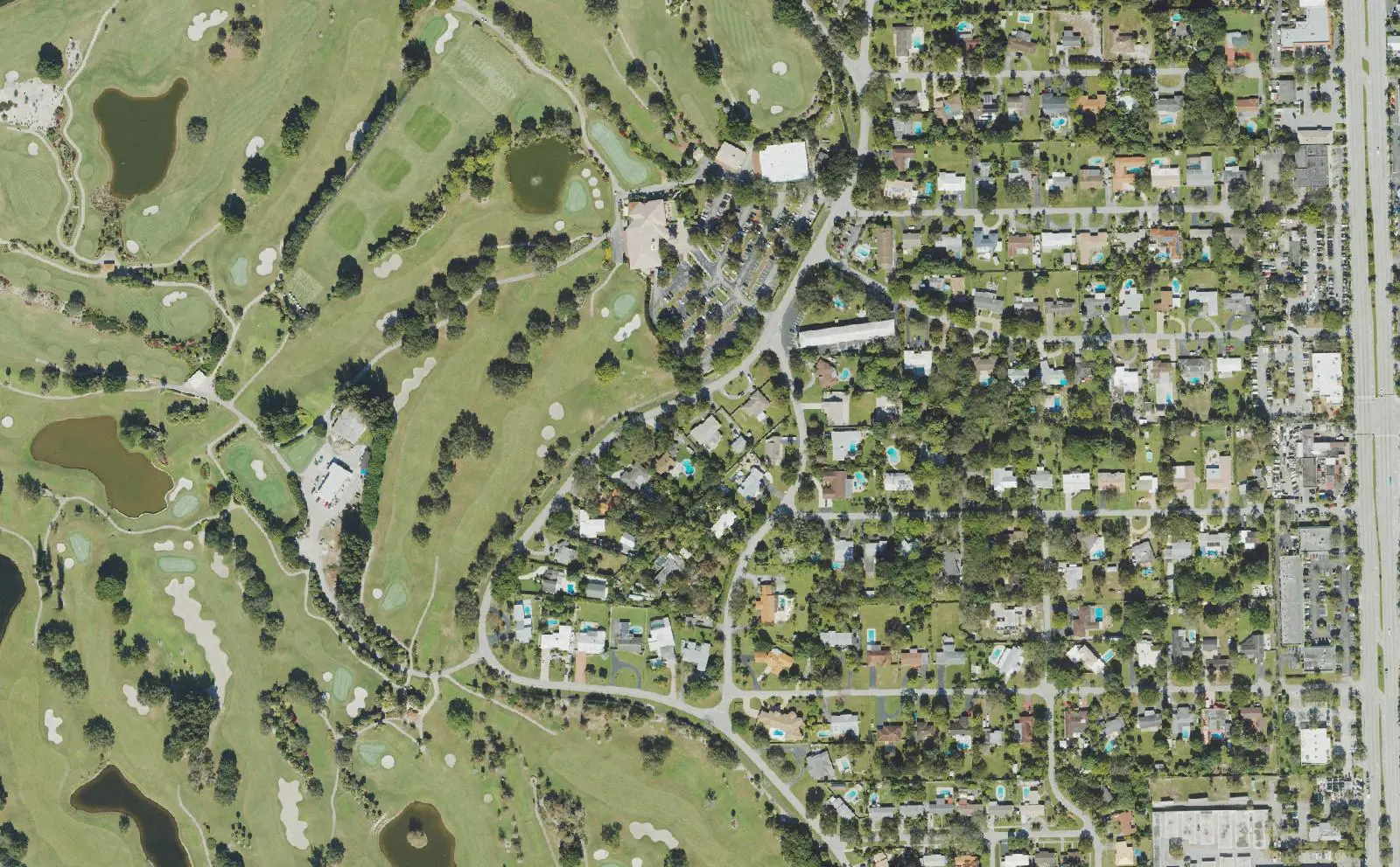 The Fort Lauderdale Country Club golf course and the streets of Country Club Estates around it in Plantation, seen from above, with State Road 7 at right.