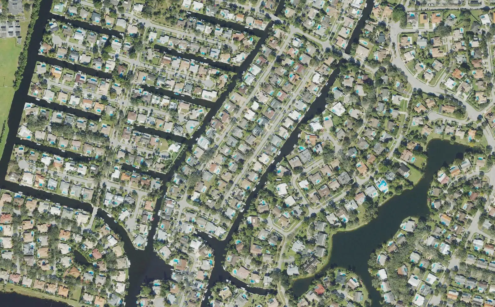 Canal-front streets in Plantation Isles, seen from above.