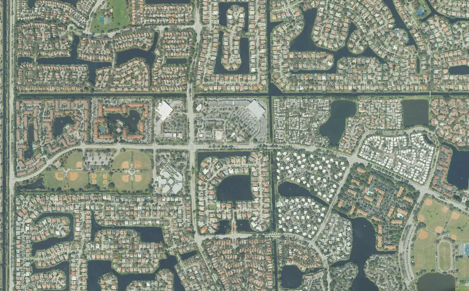 Neighborhoods on both sides of Nob Hill Road in central Plantation from above, with Sunset Park's ball fields at left and Central Park at lower right.