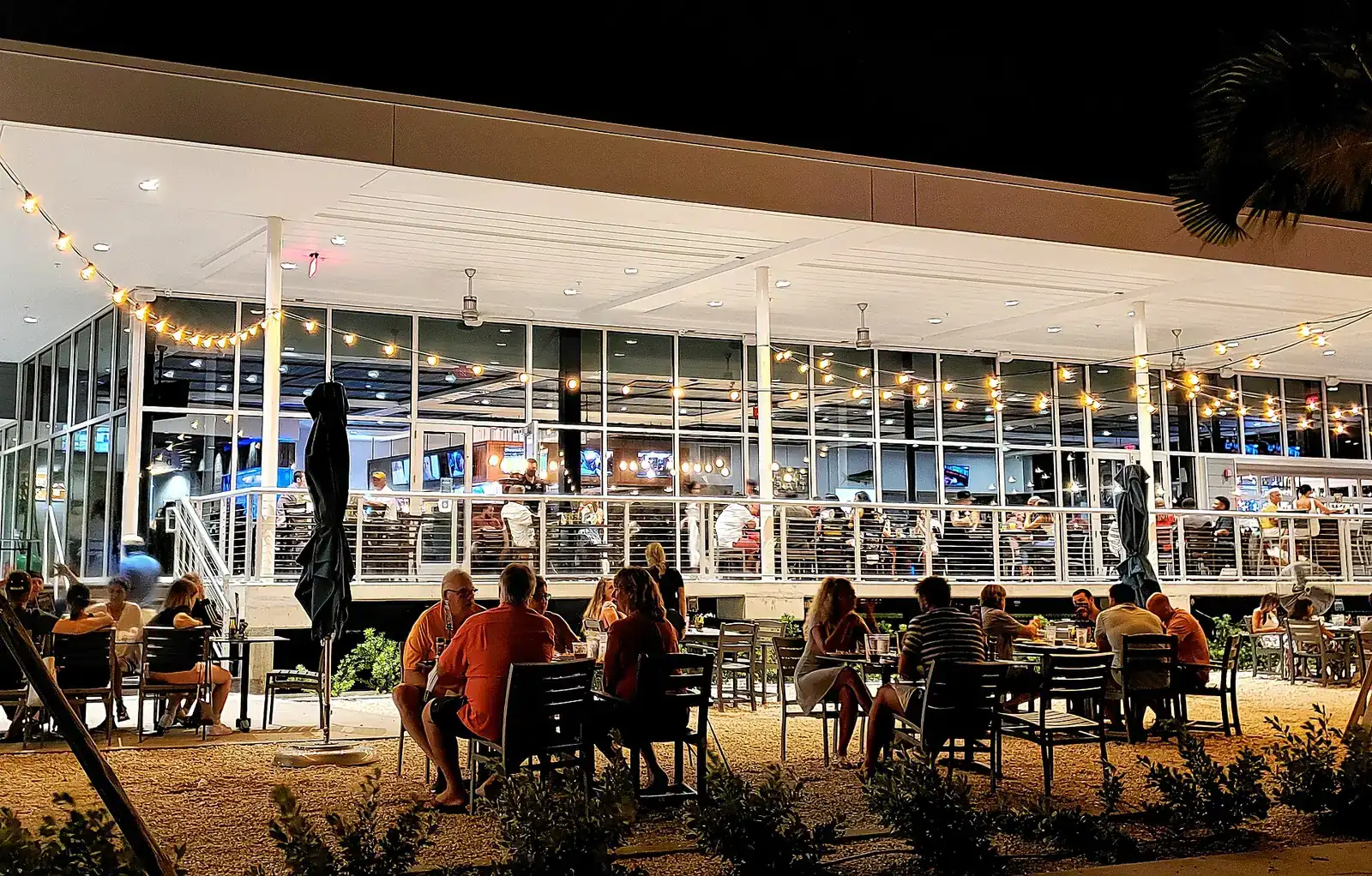 Outdoor tables at a restaurant at night in St. Petersburg, Fla.