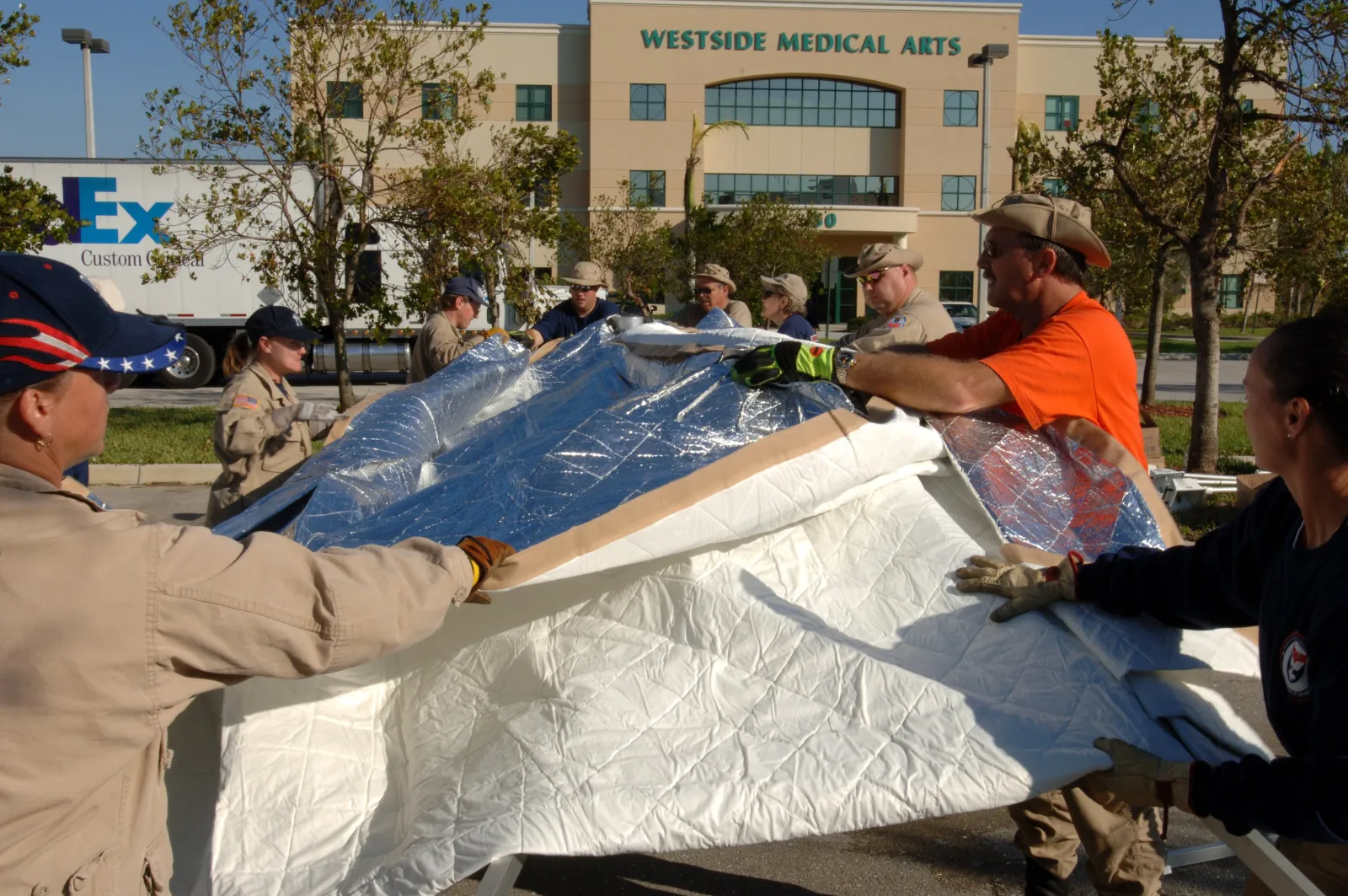 FEMA medical team members raise a tent outside Westside Medical Arts in Plantation in the aftermath of Hurricane Wilma.