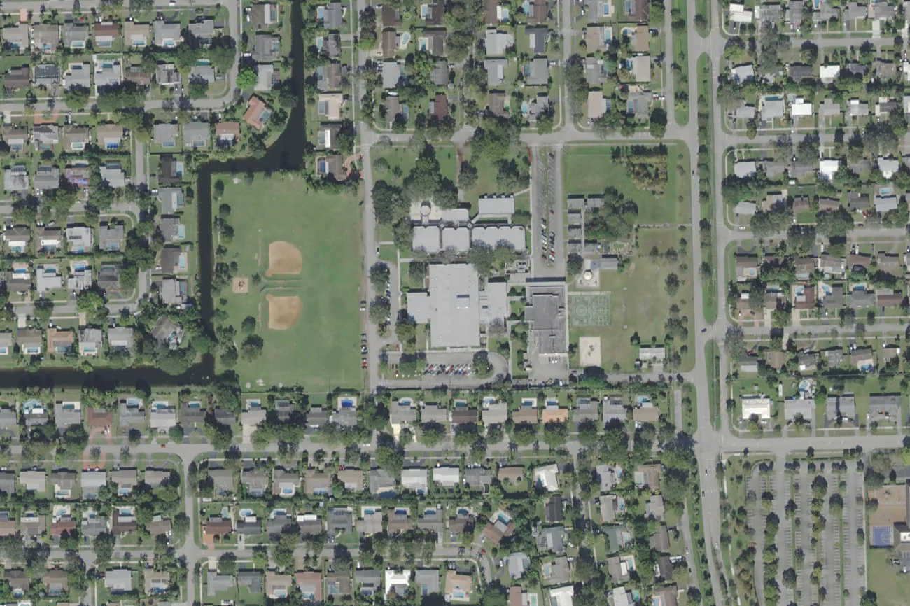 Mirror Lake Elementary School's campus on NW 72nd Avenue in Plantation, center, with its ball field to the west, seen from the air.