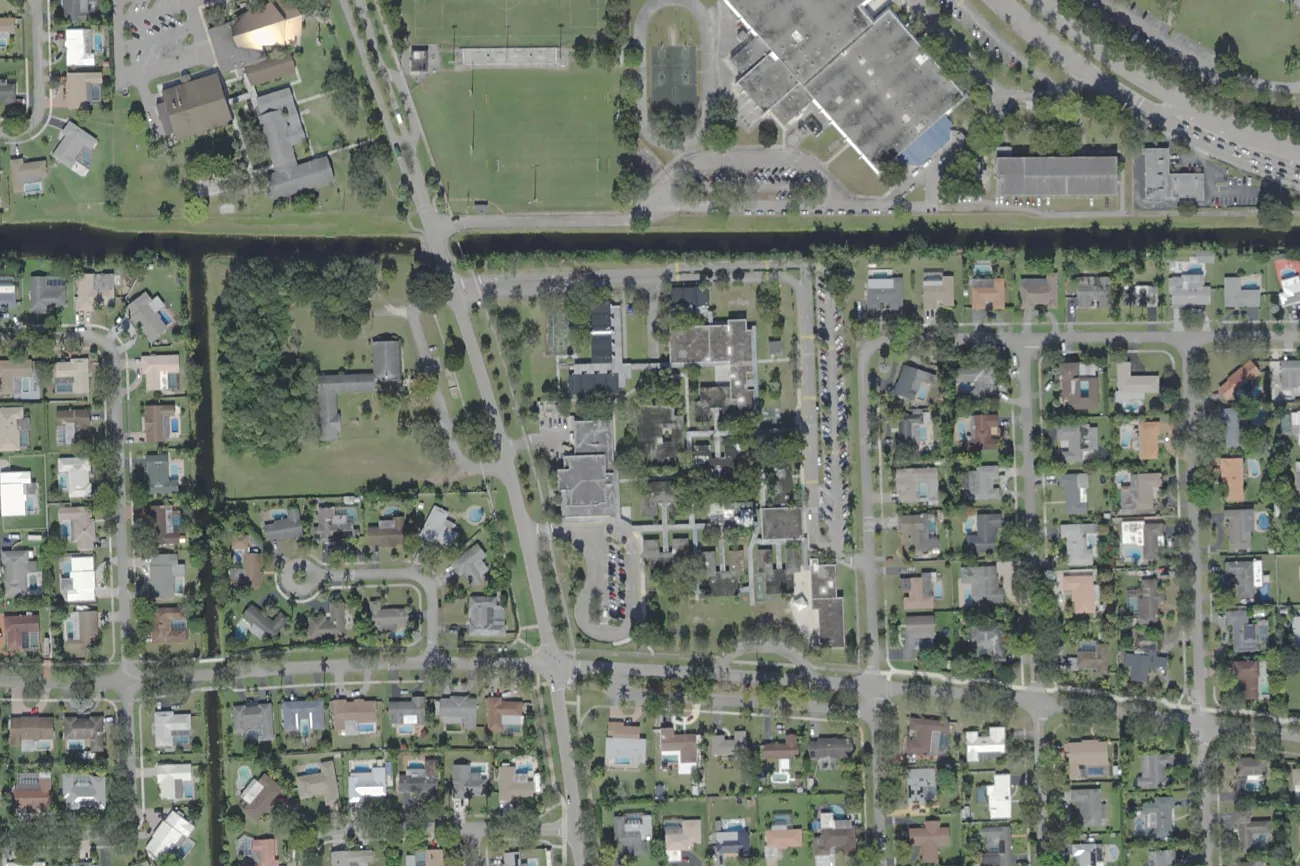 Peters Elementary School's campus on NW 68th Avenue in Plantation, center, south of the canal, seen from the air.