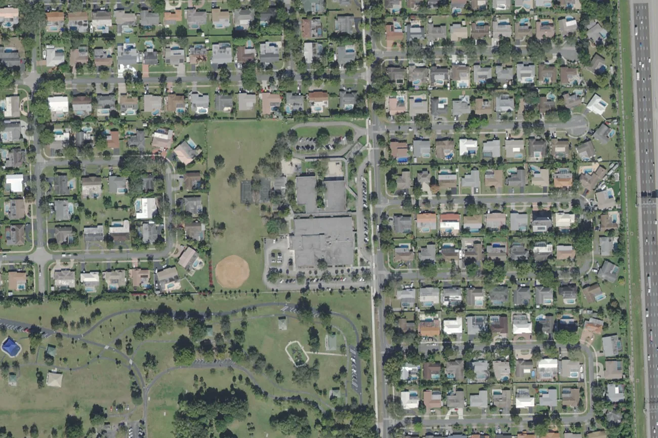 Plantation Park Elementary School's campus on SW 54th Avenue in Plantation, center, with its ball field to the southwest, seen from the air.