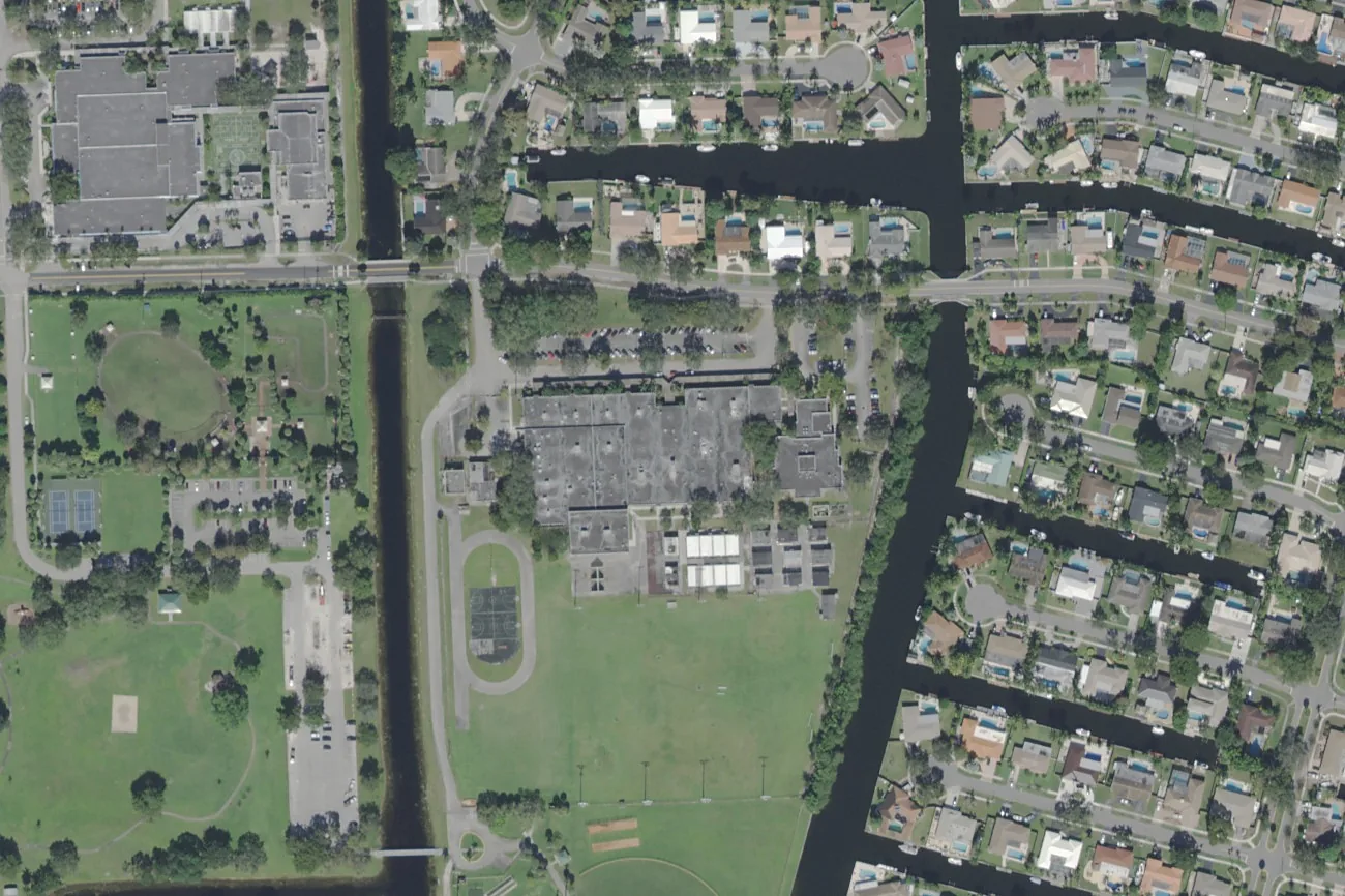 Seminole Middle School's campus on SW 16th Street in Plantation, center, with its fields and the canal to the east, seen from the air.