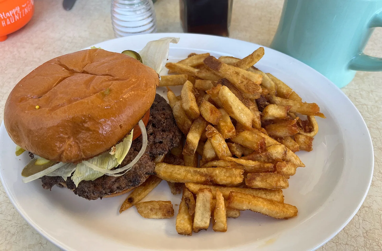 A double smash burger with fries.